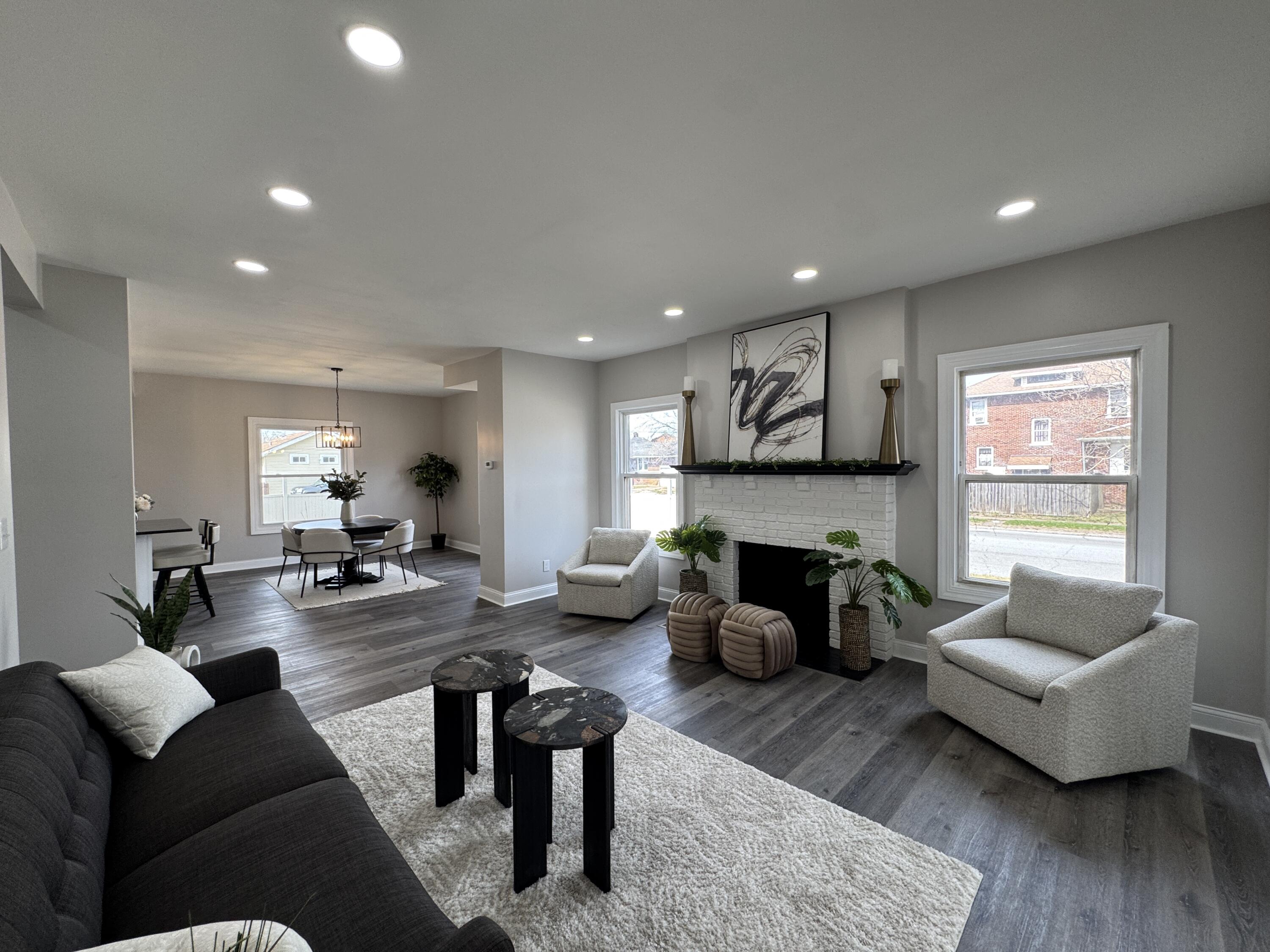 800 Buchanan Street Gary, IN 46402 - Photo 6 of 29 a living room with fireplace furniture and a wooden floor