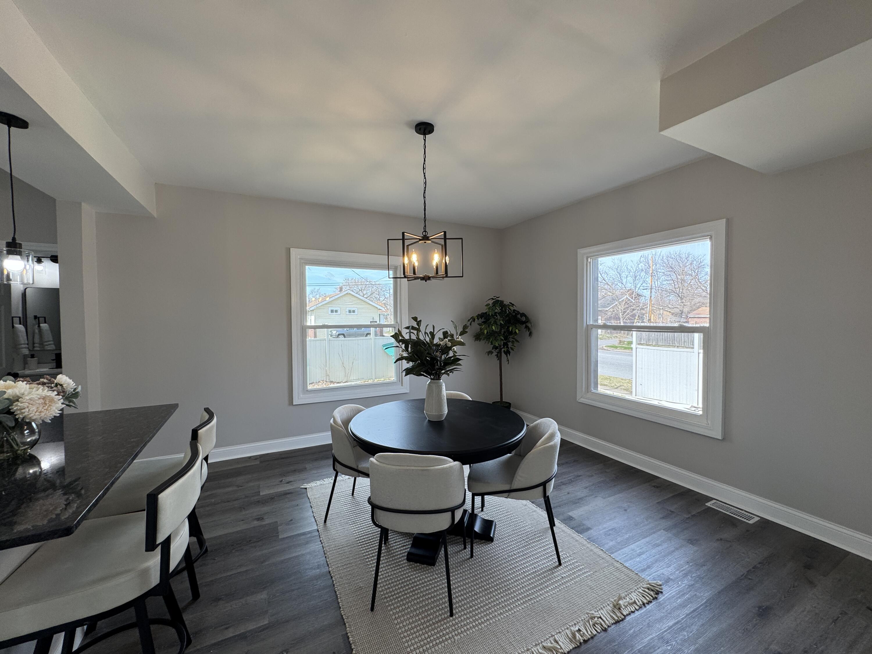 800 Buchanan Street Gary, IN 46402 - Photo 9 of 29 a dining room with furniture window wooden floor