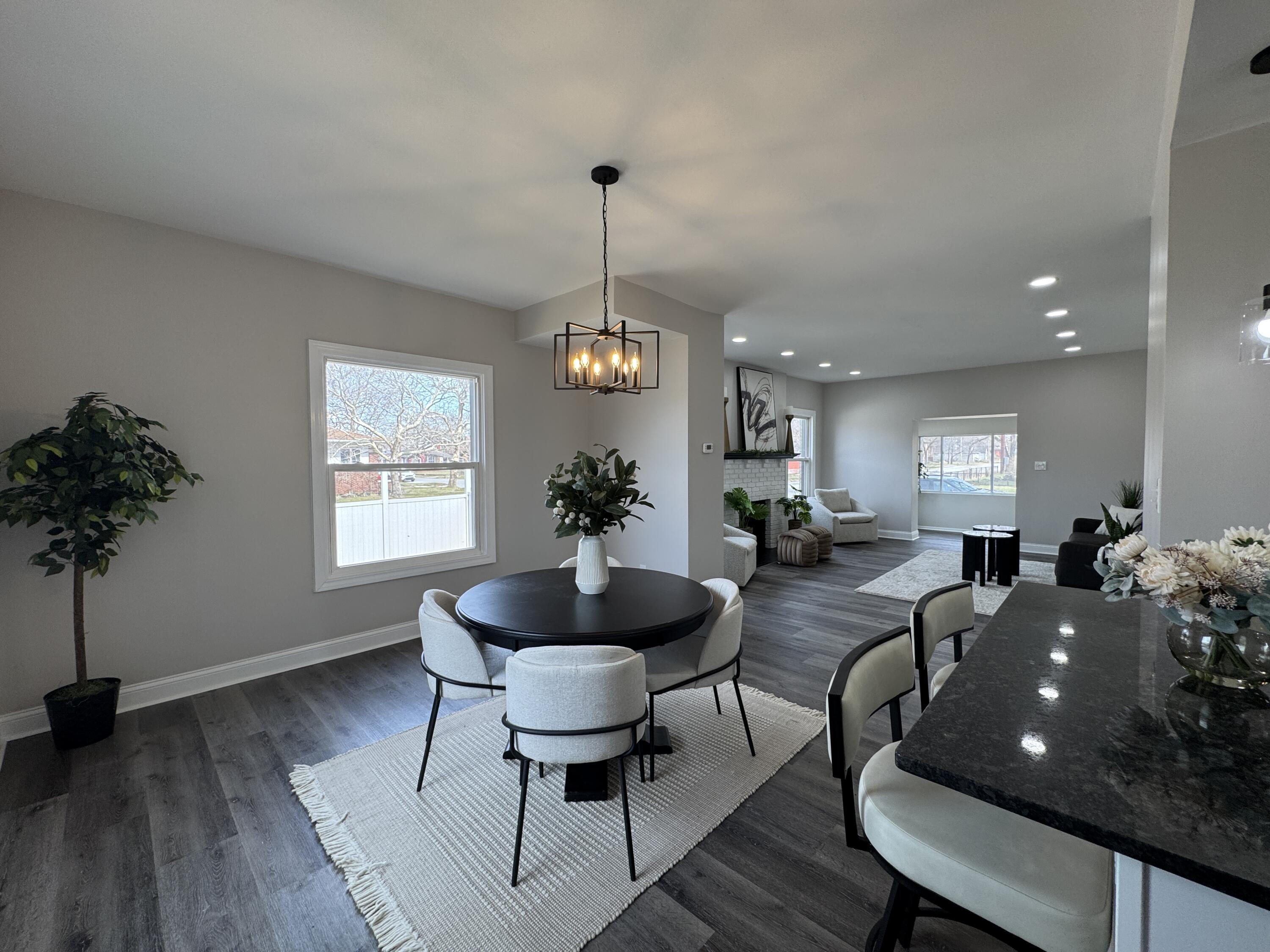 800 Buchanan Street Gary, IN 46402 - Photo 10 of 29 a living room with furniture a chandelier a rug and a window