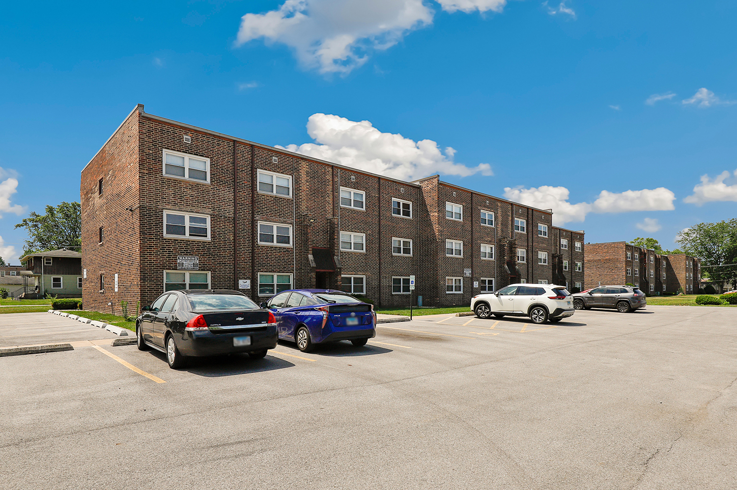 3704 215th Street, Unit 205 Matteson, IL 60443 - Photo 15 of 16 a car parked in front of a building