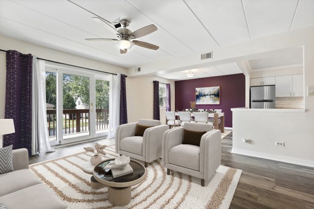 3704 215th Street, Unit 205 Matteson, IL 60443 - Photo 3 of 16 a living room with furniture and a large window