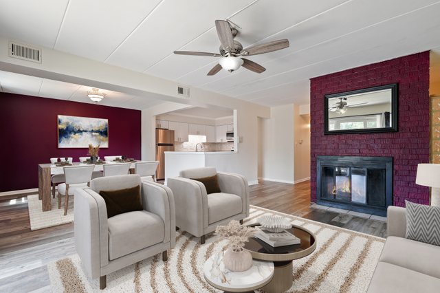 3704 215th Street, Unit 205 Matteson, IL 60443 - Photo 4 of 16 a living room with furniture a fireplace and a flat screen tv