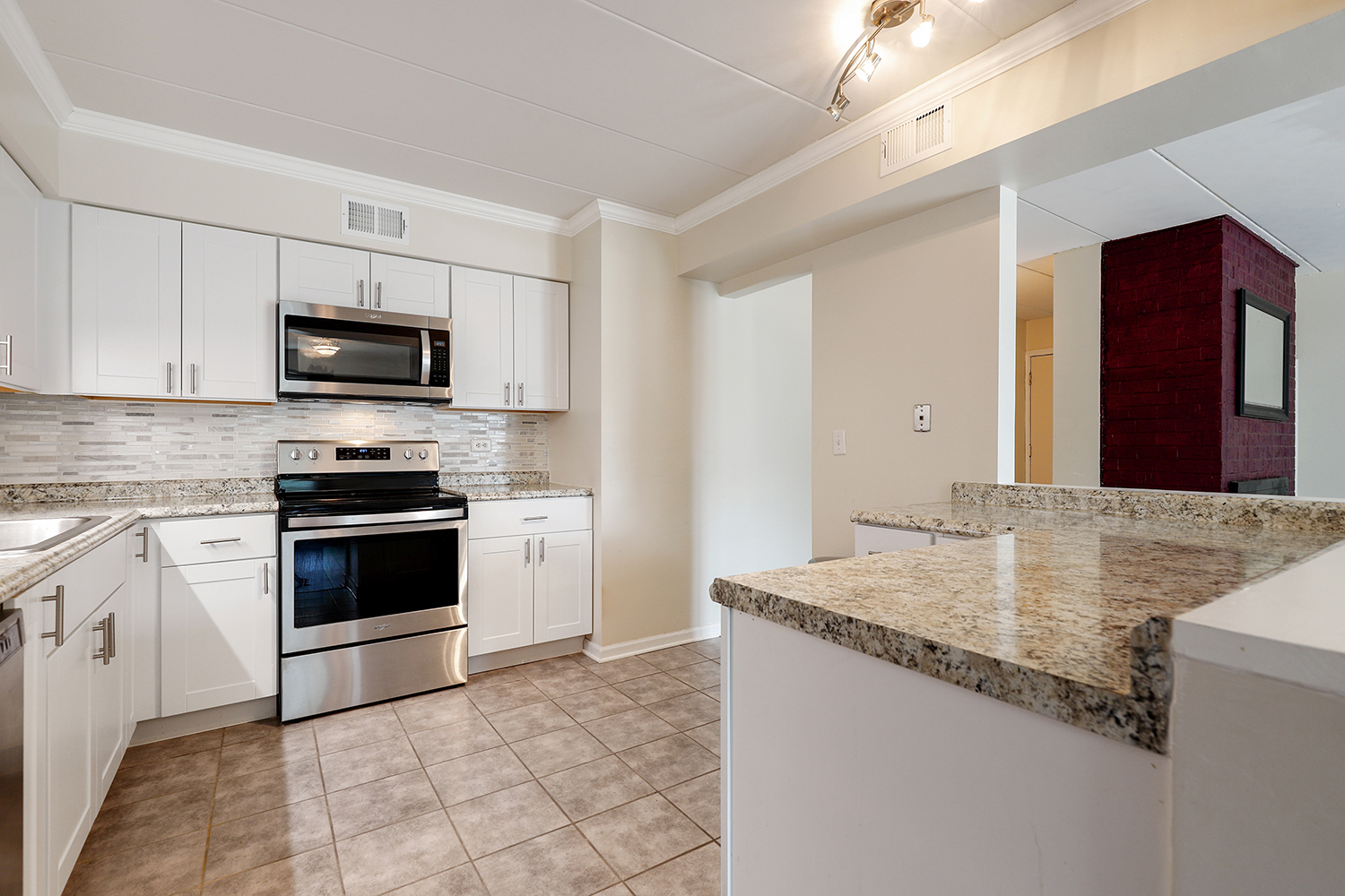 3704 215th Street, Unit 205 Matteson, IL 60443 - Photo 7 of 16 a kitchen with granite countertop a stove and a sink