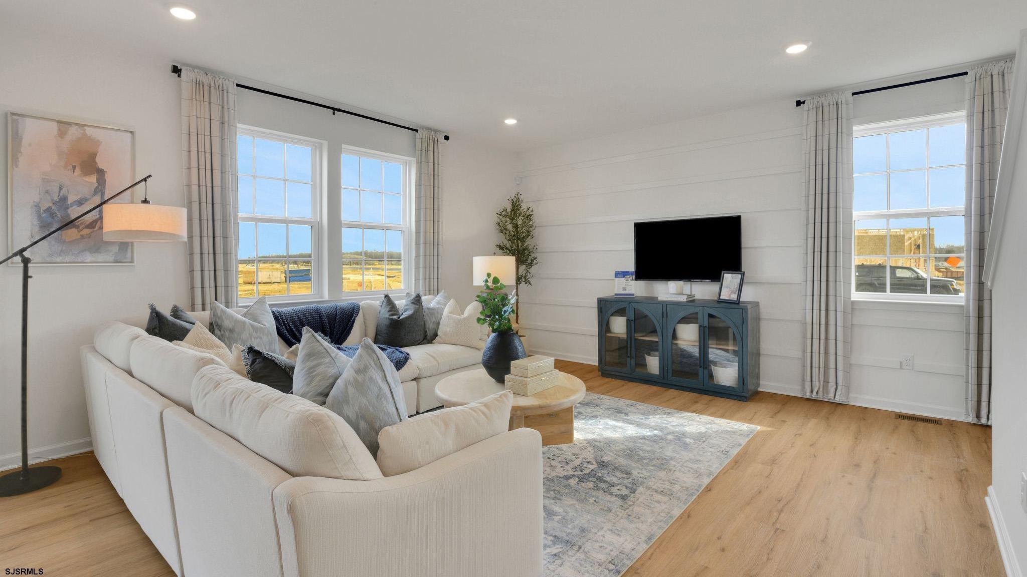 224 Daytona Road Egg Harbor Township, NJ 08234 - Photo 14 of 31 a living room with furniture and a flat screen tv
