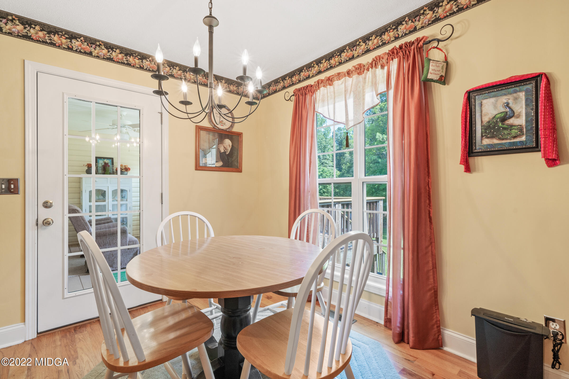 188 Whitaker Road Macon, GA 31211 - Photo 22 of 32 a view of a dining room with furniture window and wooden floor