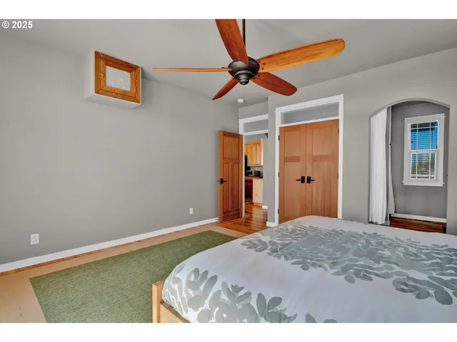 a bedroom with a bed and a walk in closet