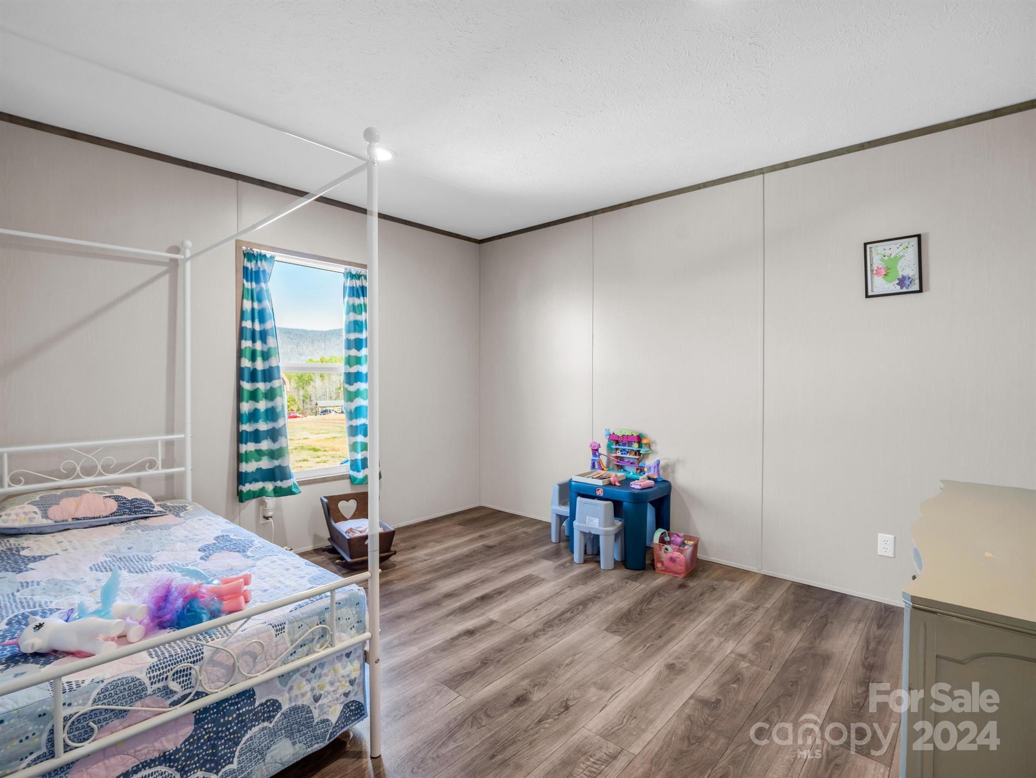 667 Salem Church Road Bostic, NC 28018 - Photo 27 of 34 a bedroom with furniture and a bed