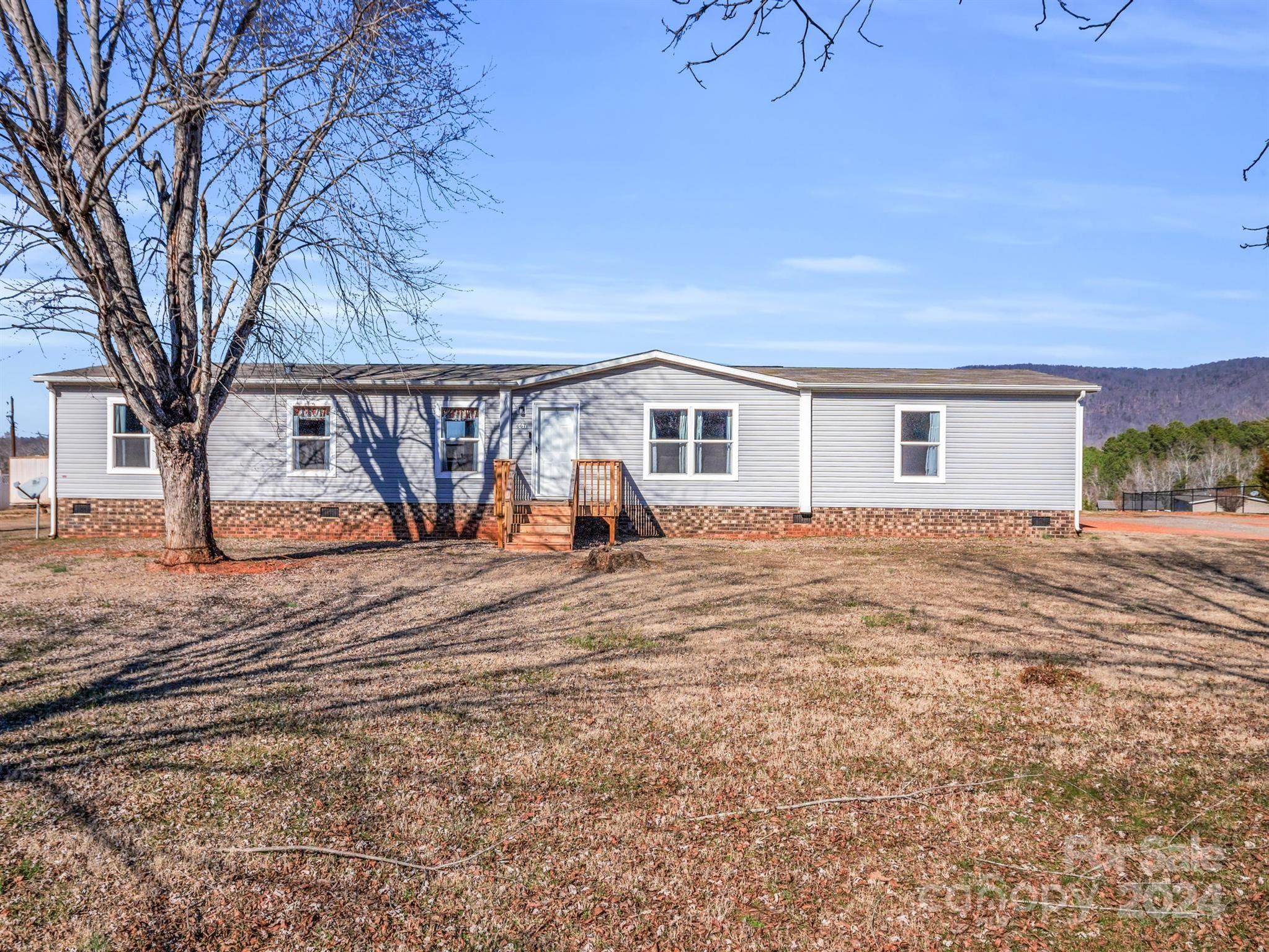 667 Salem Church Road Bostic, NC 28018 - Photo 3 of 34 a view of a house with a patio
