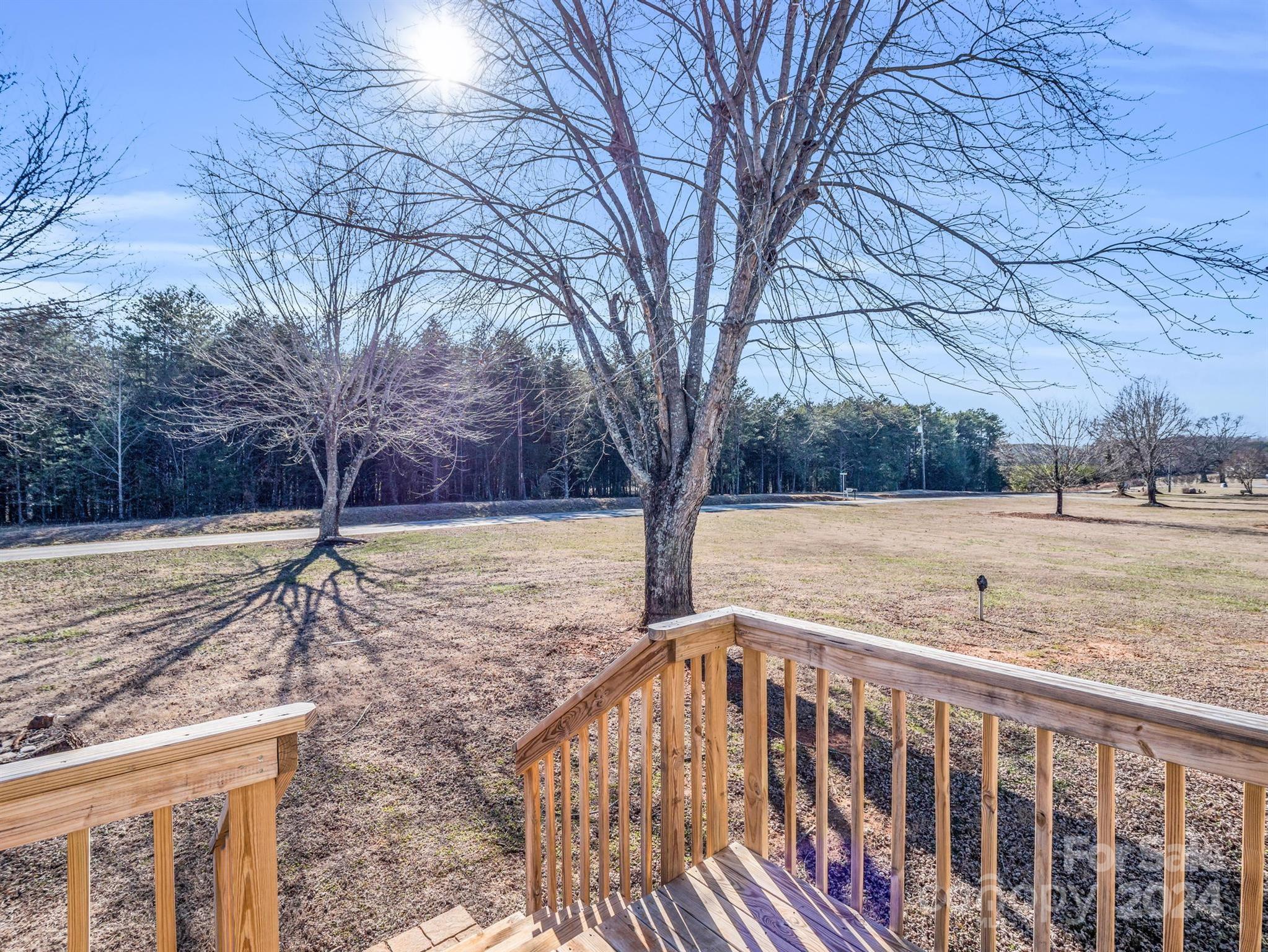 667 Salem Church Road Bostic, NC 28018 - Photo 6 of 34 a view of a yard with wooden fence