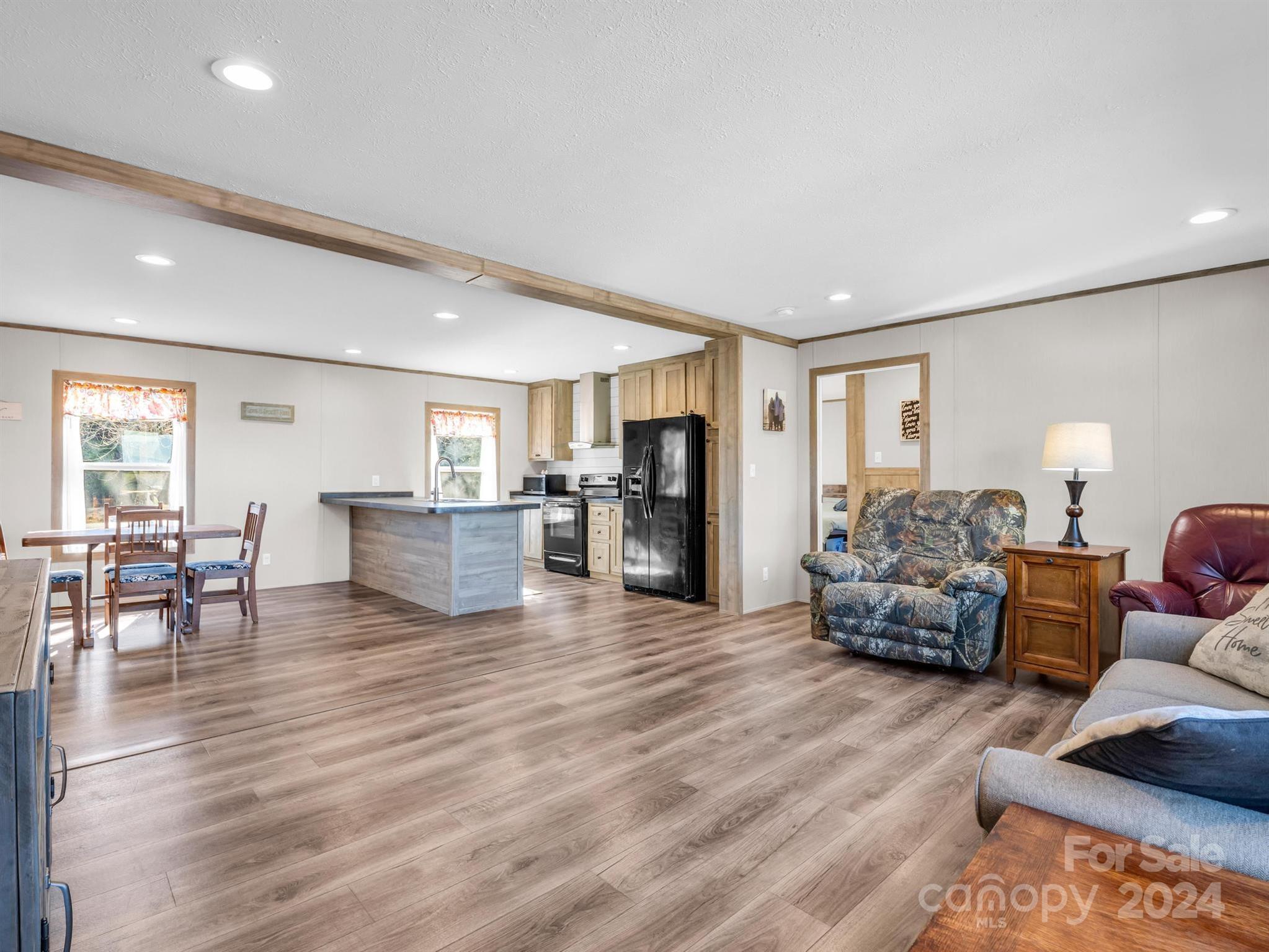 667 Salem Church Road Bostic, NC 28018 - Photo 9 of 34 a living room with furniture and a wooden floor