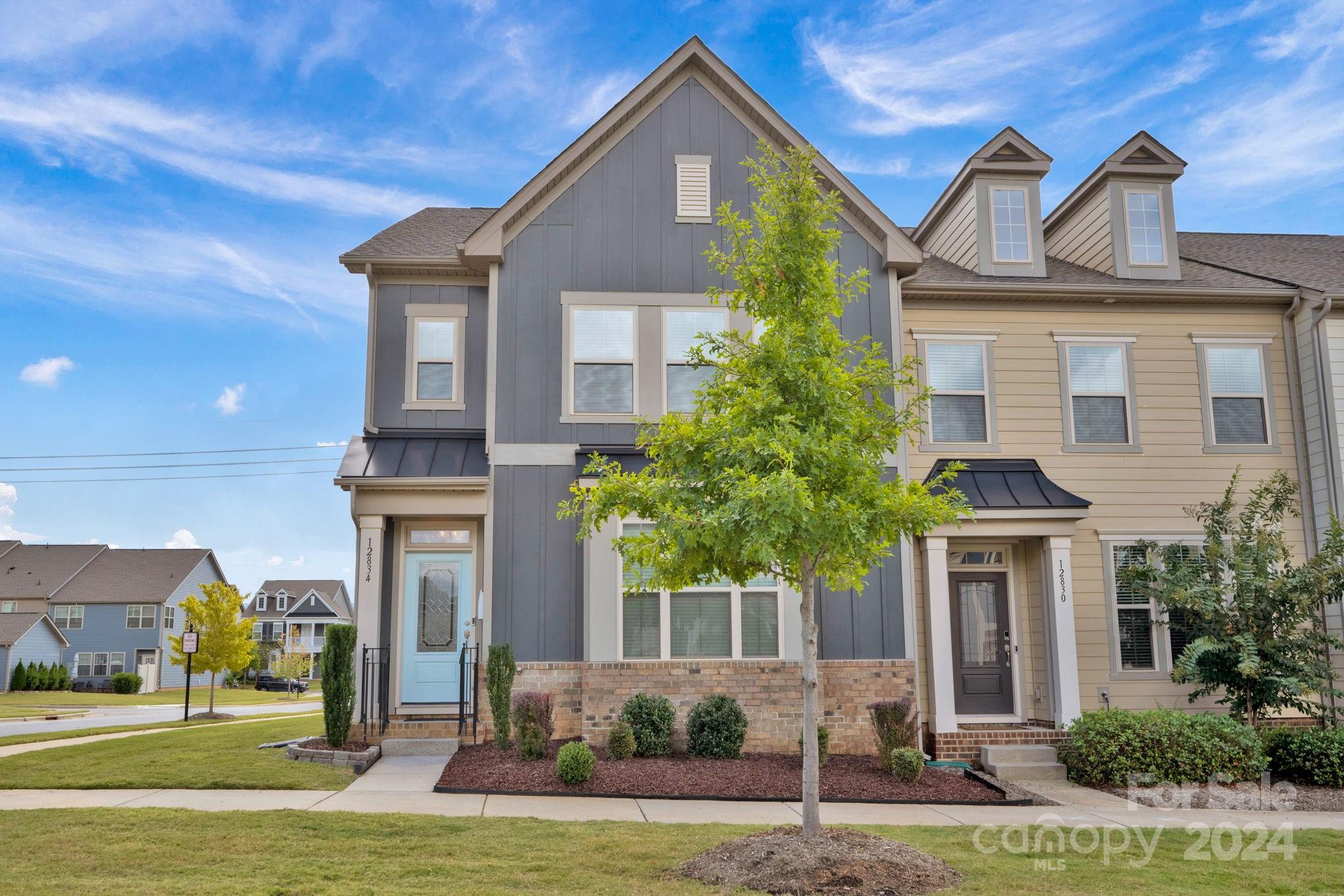 a front view of a house with a yard