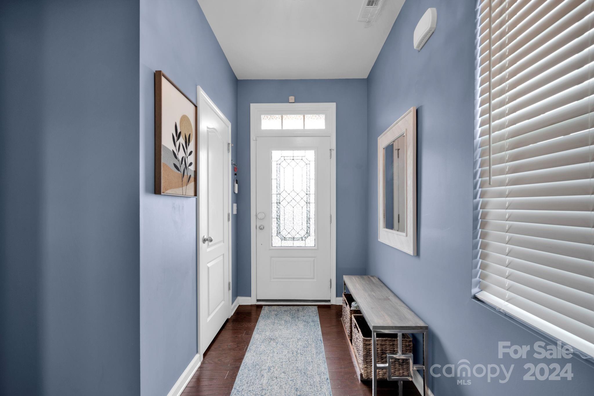 12834 Robert Walker Drive Davidson, NC 28036 - Photo 14 of 27 a view of an entryway with wooden floor