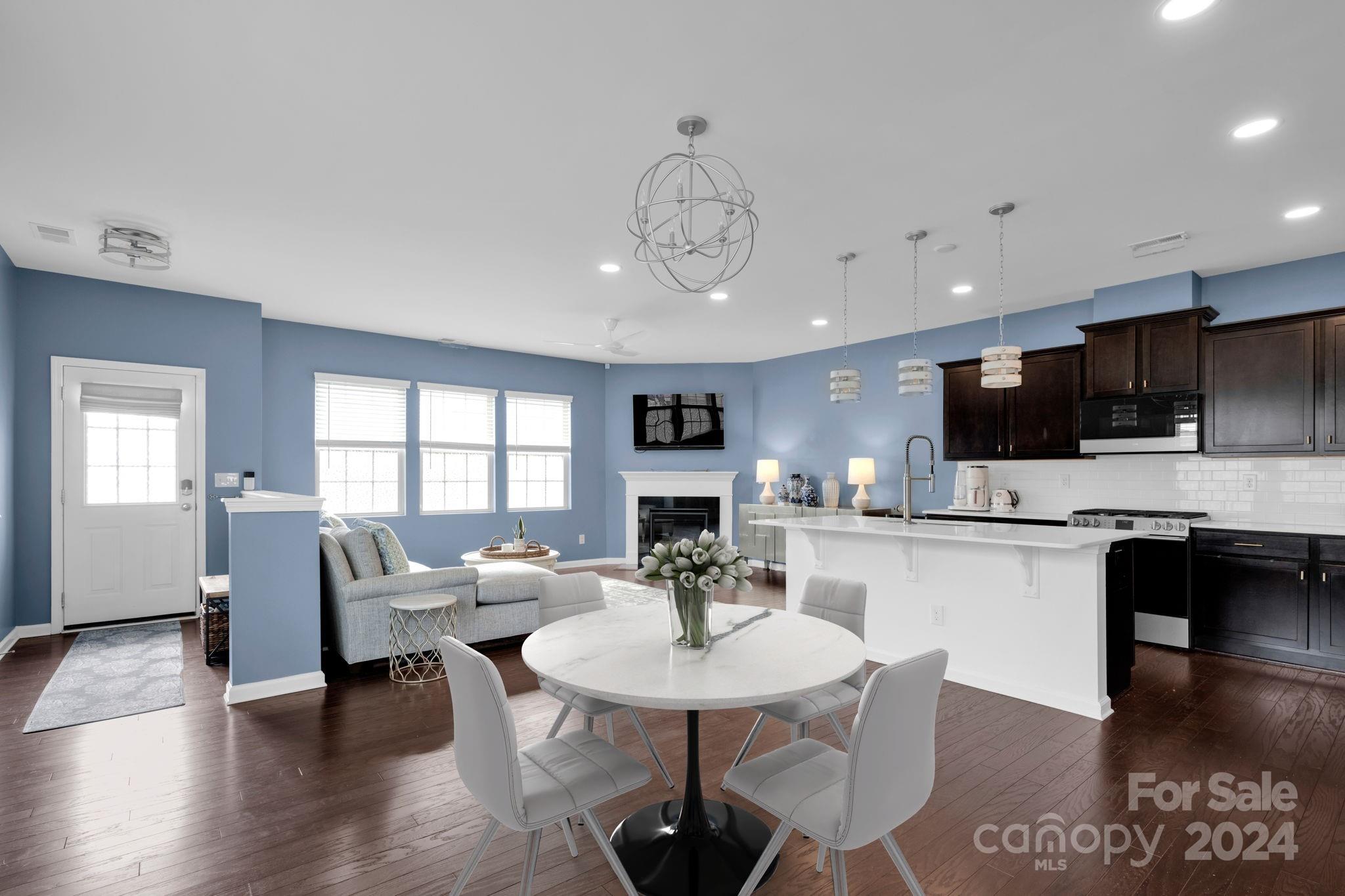 12834 Robert Walker Drive Davidson, NC 28036 - Photo 2 of 27 a view of a dining room with furniture window and wooden floor