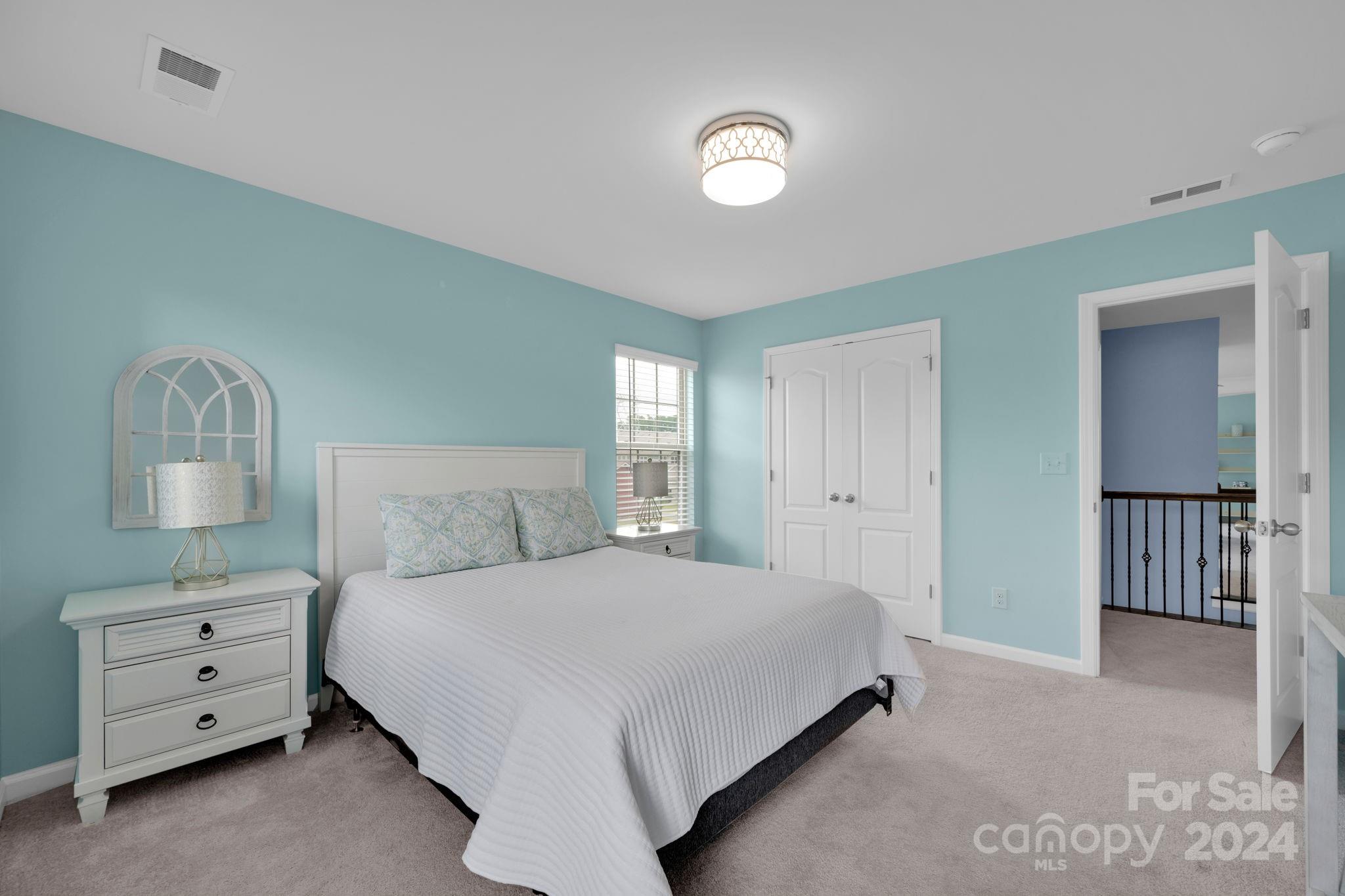 12834 Robert Walker Drive Davidson, NC 28036 - Photo 22 of 27 a bedroom with a bed and a dresser