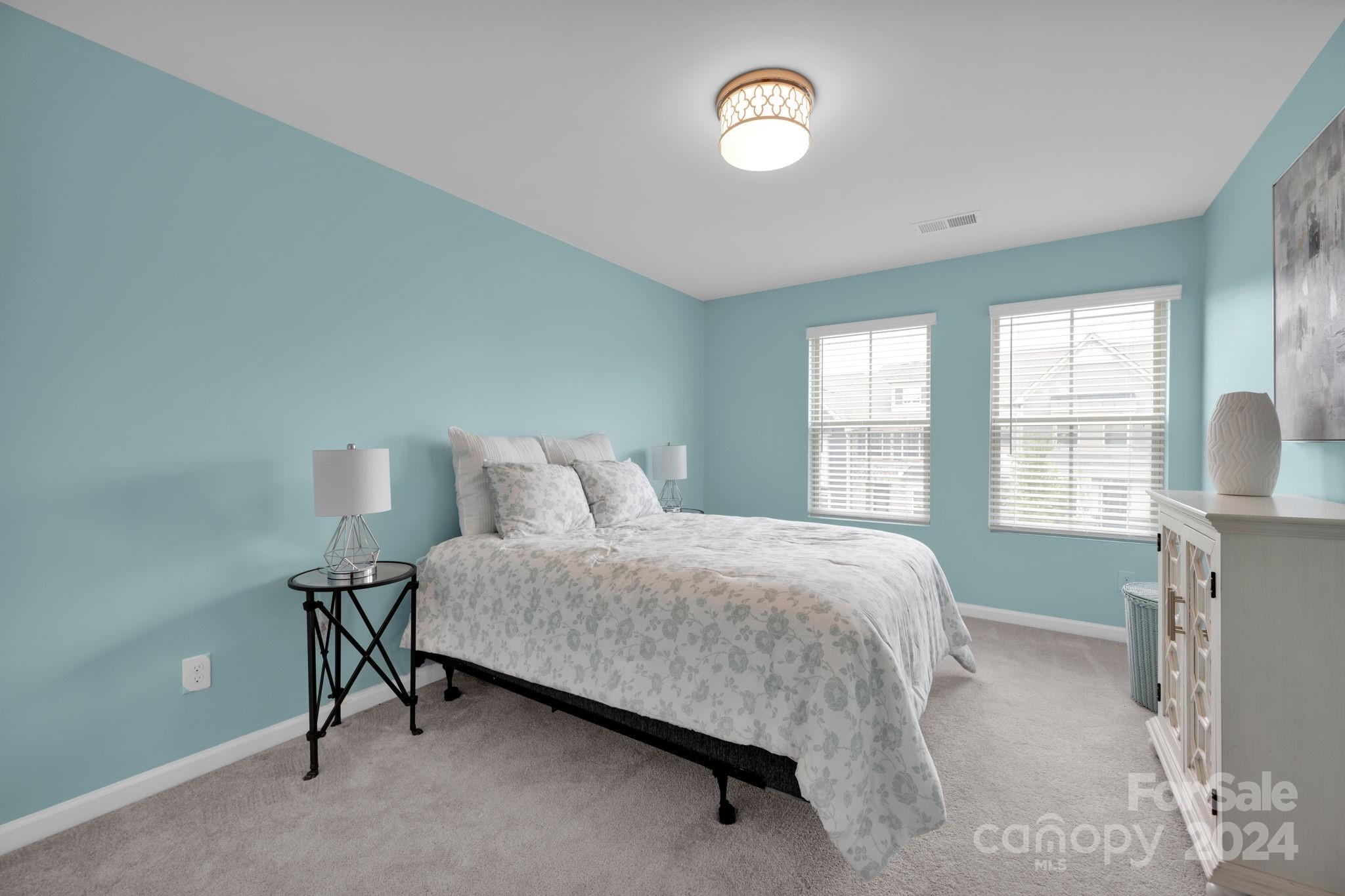 12834 Robert Walker Drive Davidson, NC 28036 - Photo 23 of 27 a bedroom with a bed and a window