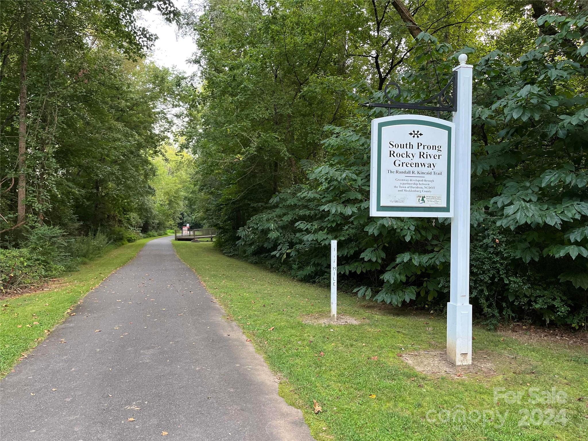 12834 Robert Walker Drive Davidson, NC 28036 - Photo 26 of 27 a view of a street with trees and bushes