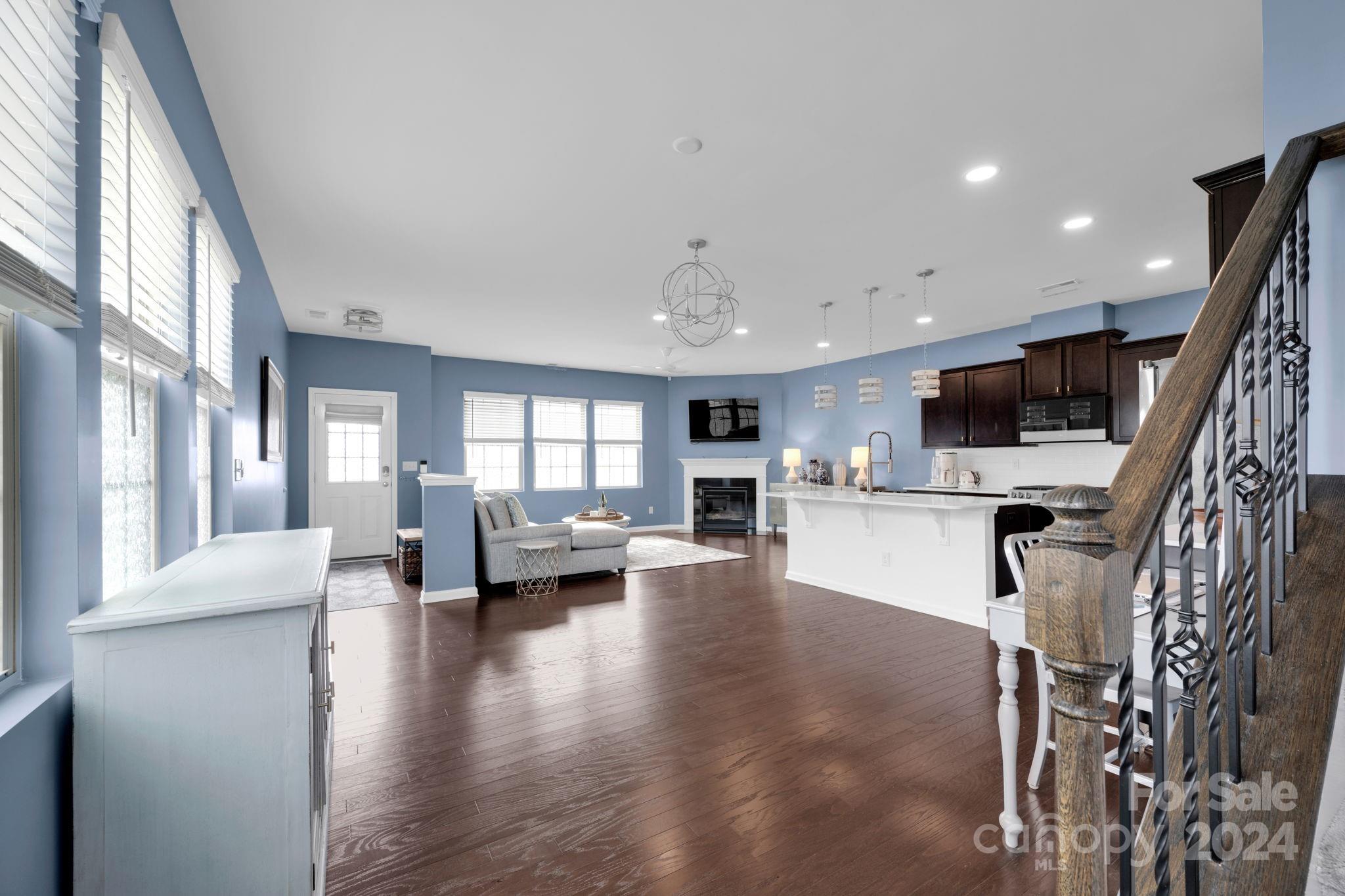 12834 Robert Walker Drive Davidson, NC 28036 - Photo 9 of 27 a living room with furniture and a flat screen tv