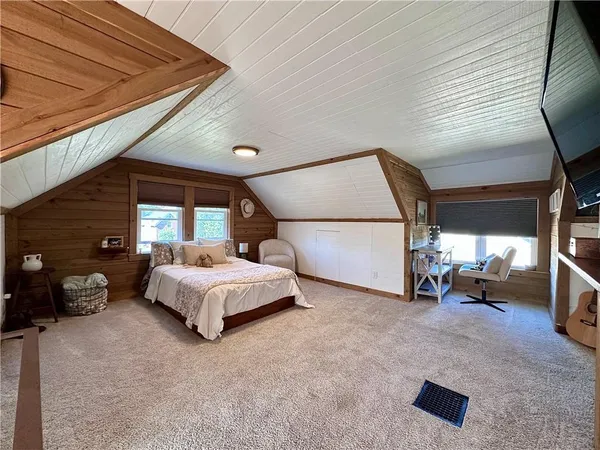 a bed room with a bed and a large walk in closet