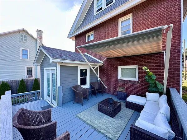 a view of a patio with couches chairs and a fire pit