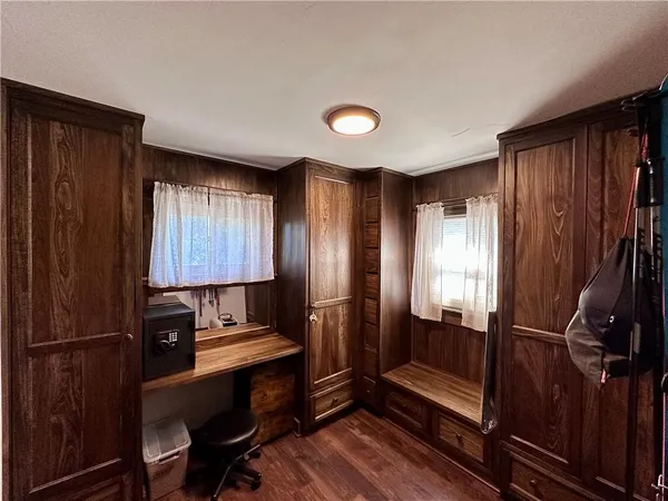 a view of kitchen with cabinets