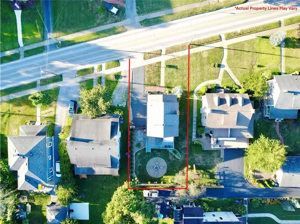 an aerial view of multiple houses with yard