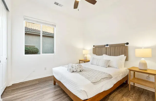 a bedroom with a bed and window