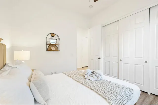 a bedroom with a bed and a table