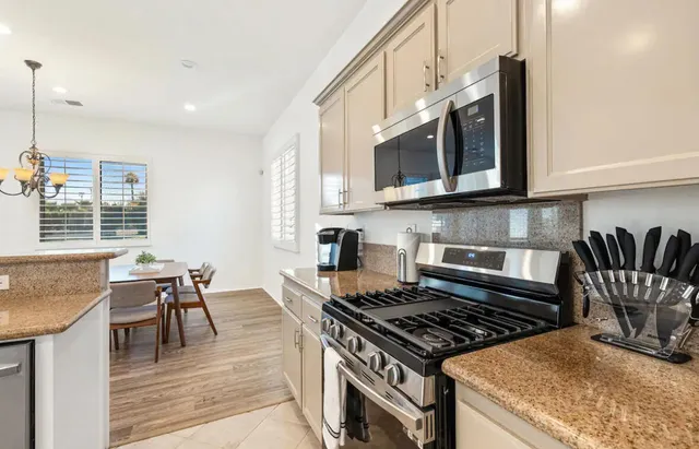 a kitchen with a stove and a microwave