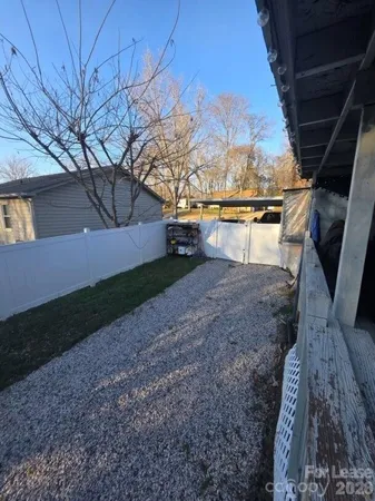 a view of backyard with large tree
