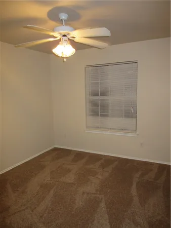 a view of wooden floor and chandelier in a room