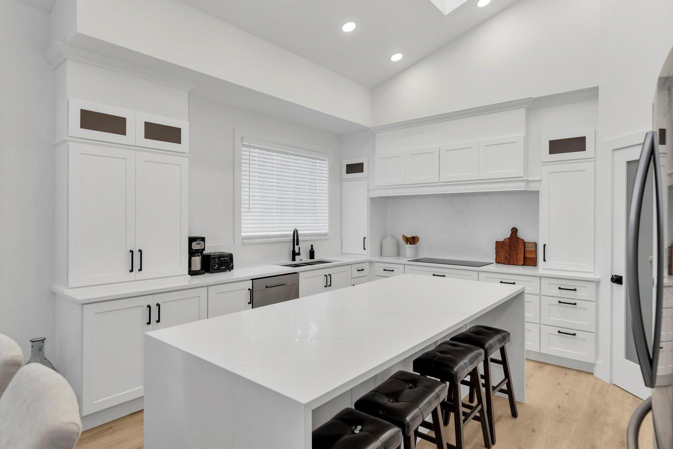 6391 Northwest 23rd Lane Boca Raton, FL 33434 - Photo 11 of 49 a kitchen with white cabinets and white appliances