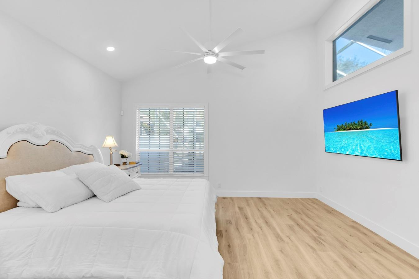 6391 Northwest 23rd Lane Boca Raton, FL 33434 - Photo 15 of 49 a bedroom with a bed and a window