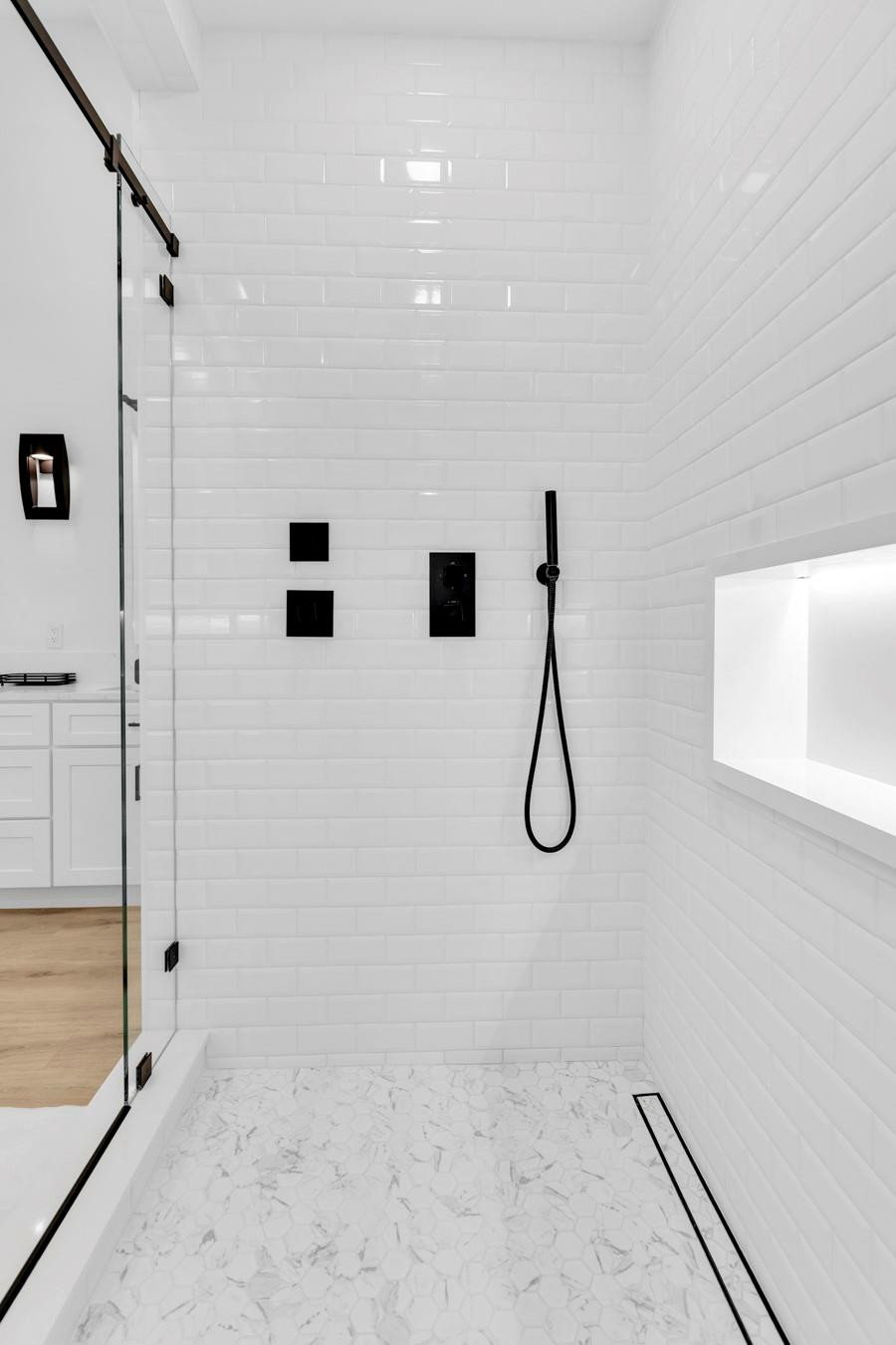 6391 Northwest 23rd Lane Boca Raton, FL 33434 - Photo 18 of 49 a bathroom with a granite countertop shower and a mirror