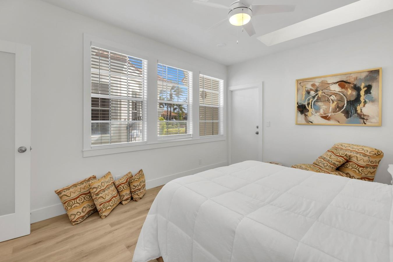 6391 Northwest 23rd Lane Boca Raton, FL 33434 - Photo 20 of 49 a bedroom with a bed and wooden floor