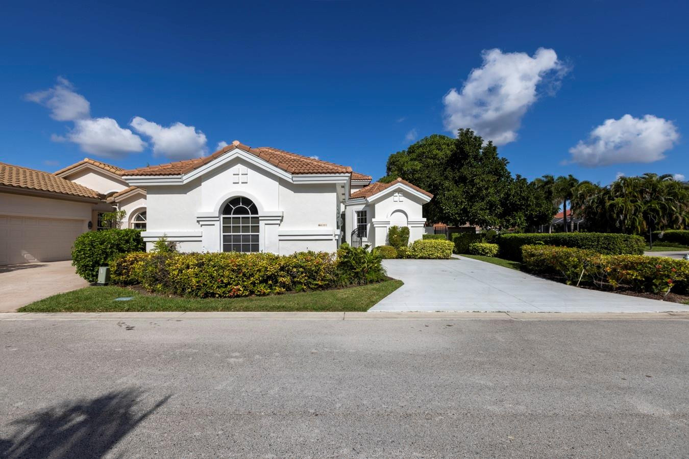 6391 Northwest 23rd Lane Boca Raton, FL 33434 - Photo 2 of 49 a view of a house with a yard and garage