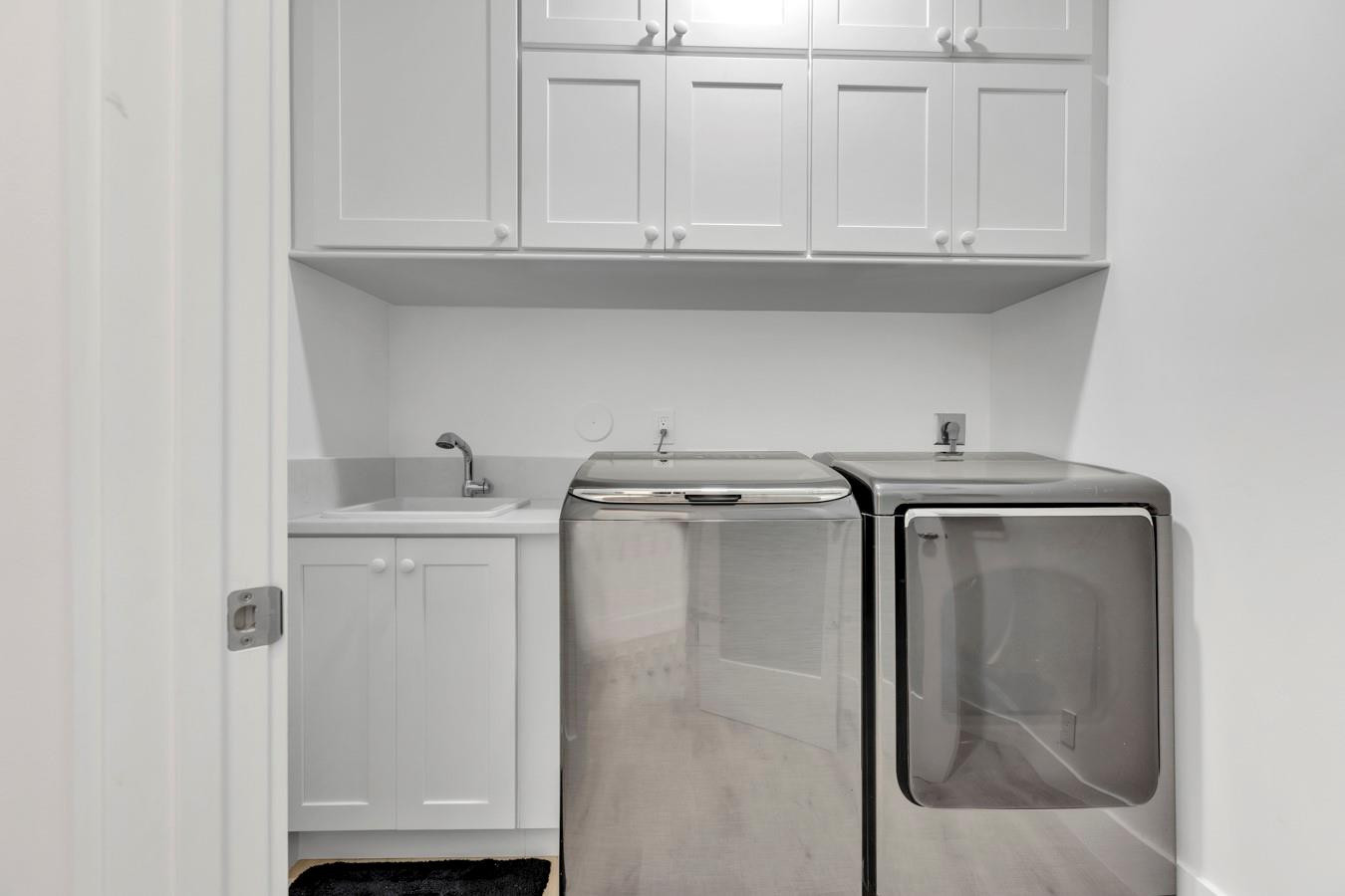 6391 Northwest 23rd Lane Boca Raton, FL 33434 - Photo 22 of 49 a utility room with dryer and washer