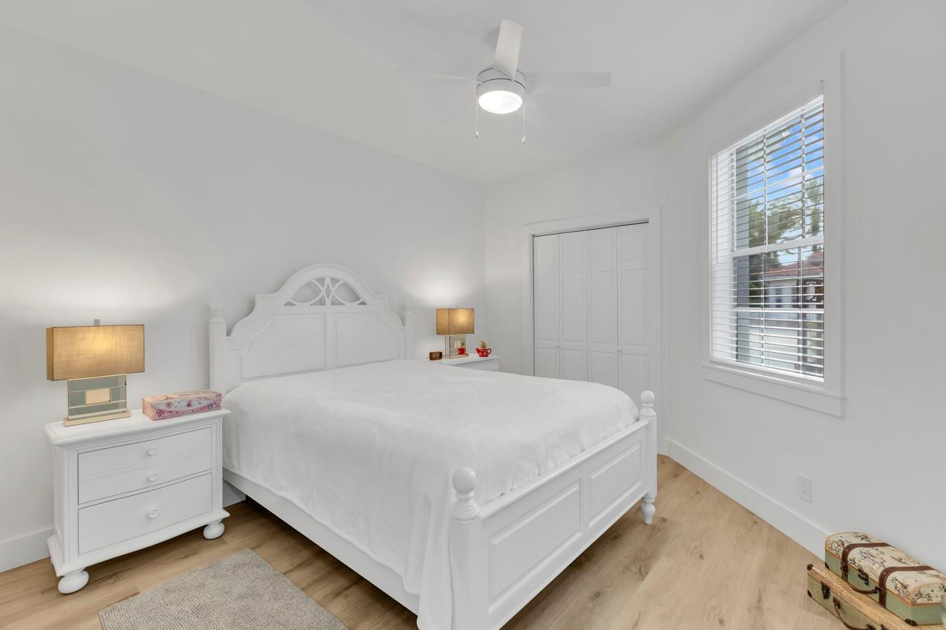6391 Northwest 23rd Lane Boca Raton, FL 33434 - Photo 23 of 49 a large bed sitting in a bedroom next to a window