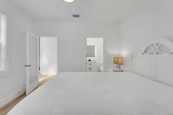 a large white bed in a white room