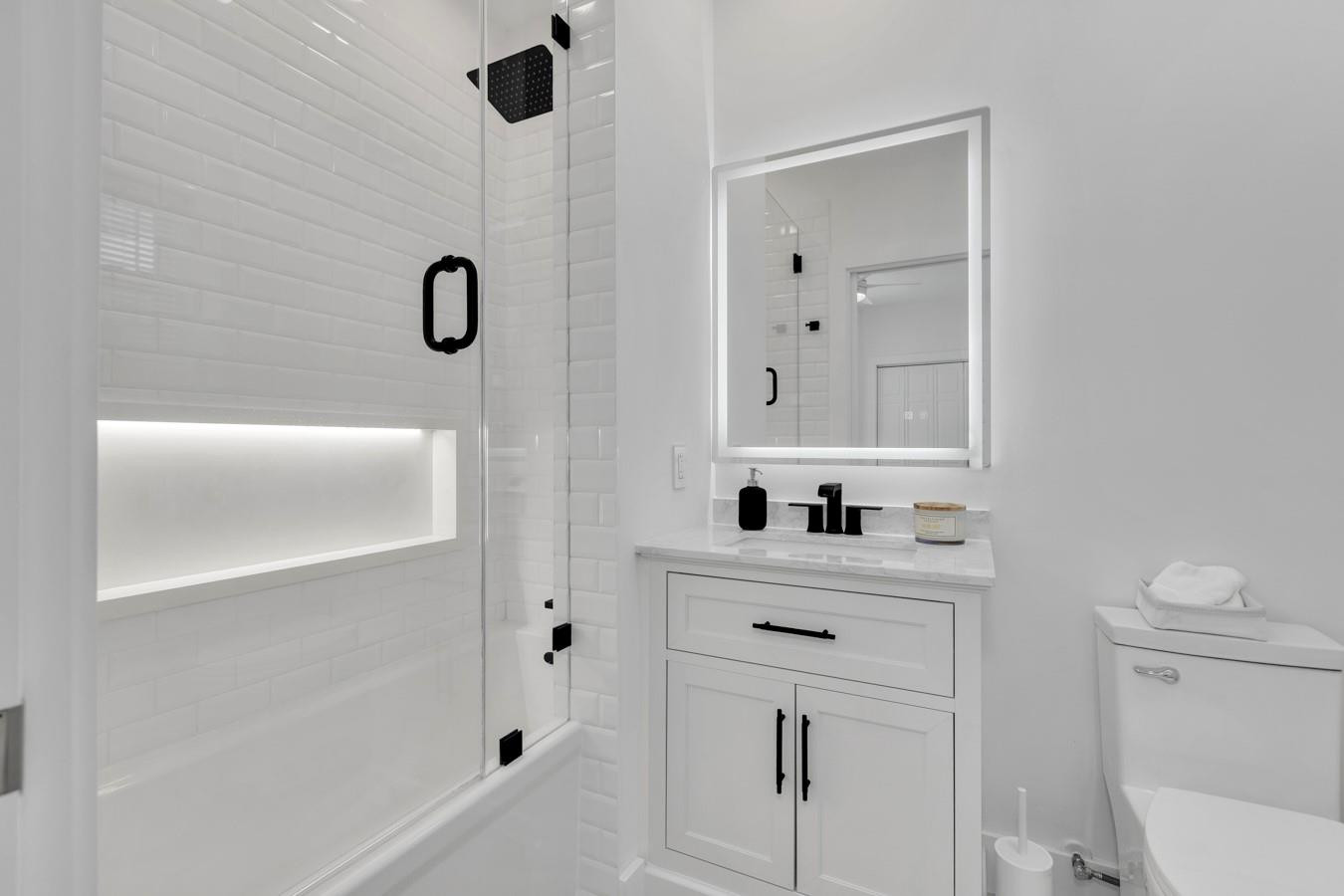 6391 Northwest 23rd Lane Boca Raton, FL 33434 - Photo 25 of 49 a bathroom with a sink a toilet and shower