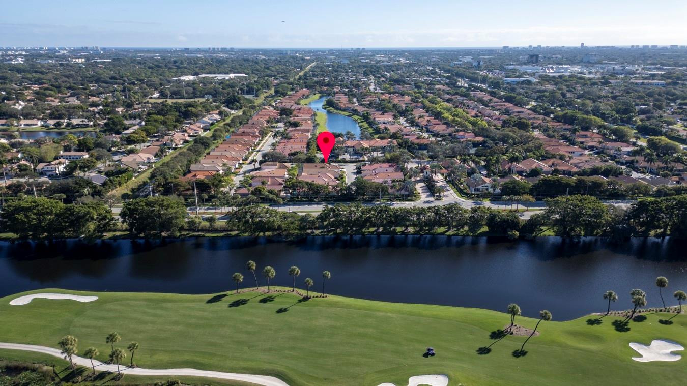 6391 Northwest 23rd Lane Boca Raton, FL 33434 - Photo 35 of 49 an aerial view of residential houses with outdoor space and lake view