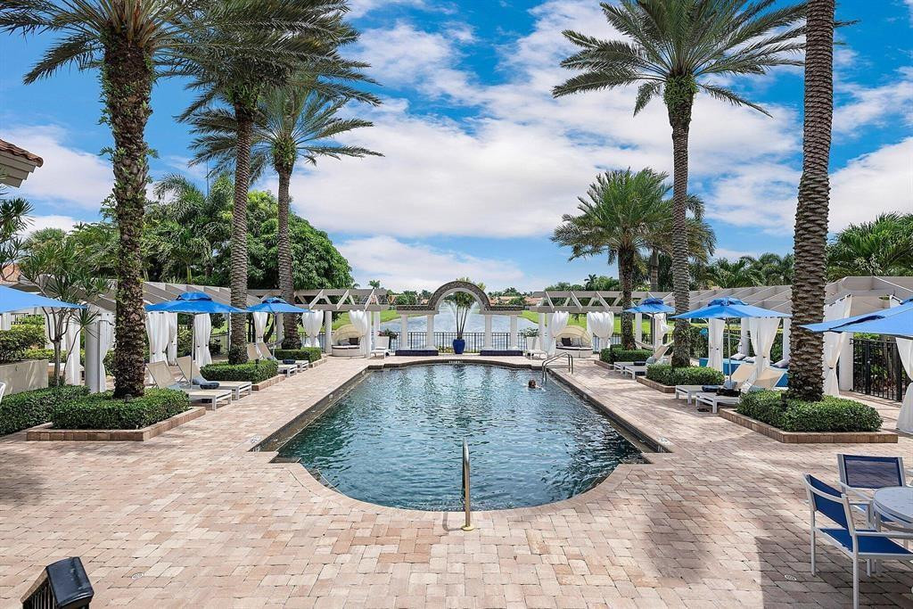 6391 Northwest 23rd Lane Boca Raton, FL 33434 - Photo 47 of 49 a view of a swimming pool with a lounge chairs