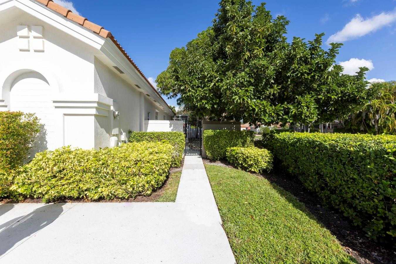 6391 Northwest 23rd Lane Boca Raton, FL 33434 - Photo 5 of 49 a view of a garden with pathway