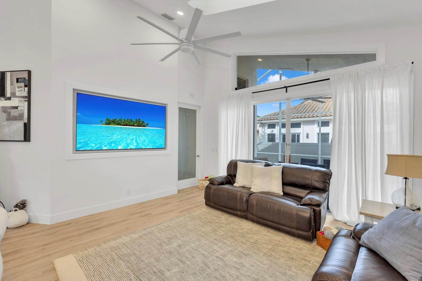 6391 Northwest 23rd Lane Boca Raton, FL 33434 - Photo 7 of 49 a living room with furniture and a flat screen tv