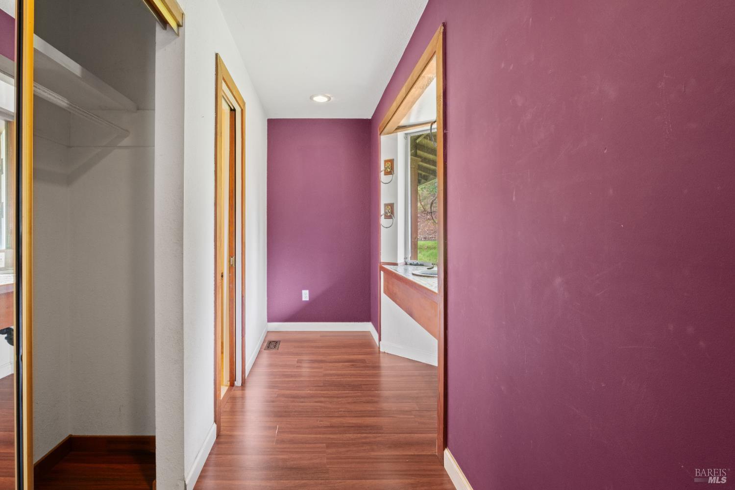 681 Branscomb Road Laytonville, CA 95454 - Photo 16 of 27 a view of hallway with livingroom and wooden floor