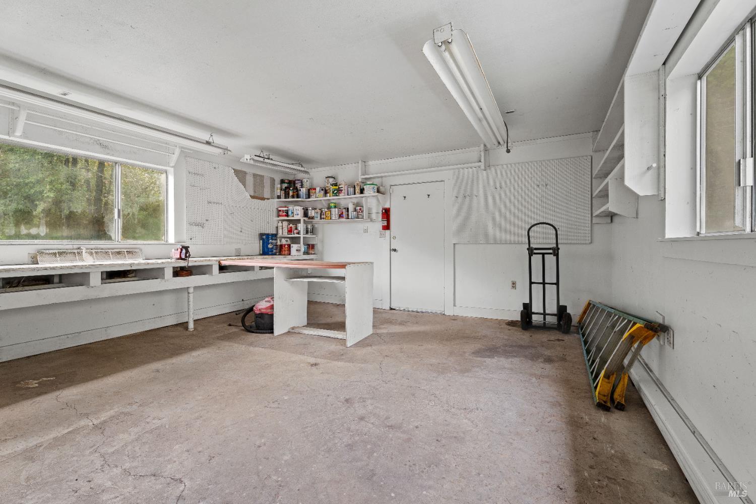 681 Branscomb Road Laytonville, CA 95454 - Photo 23 of 27 a kitchen with refrigerator and cabinets