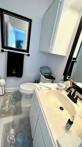 a bathroom with a sink and mirror
