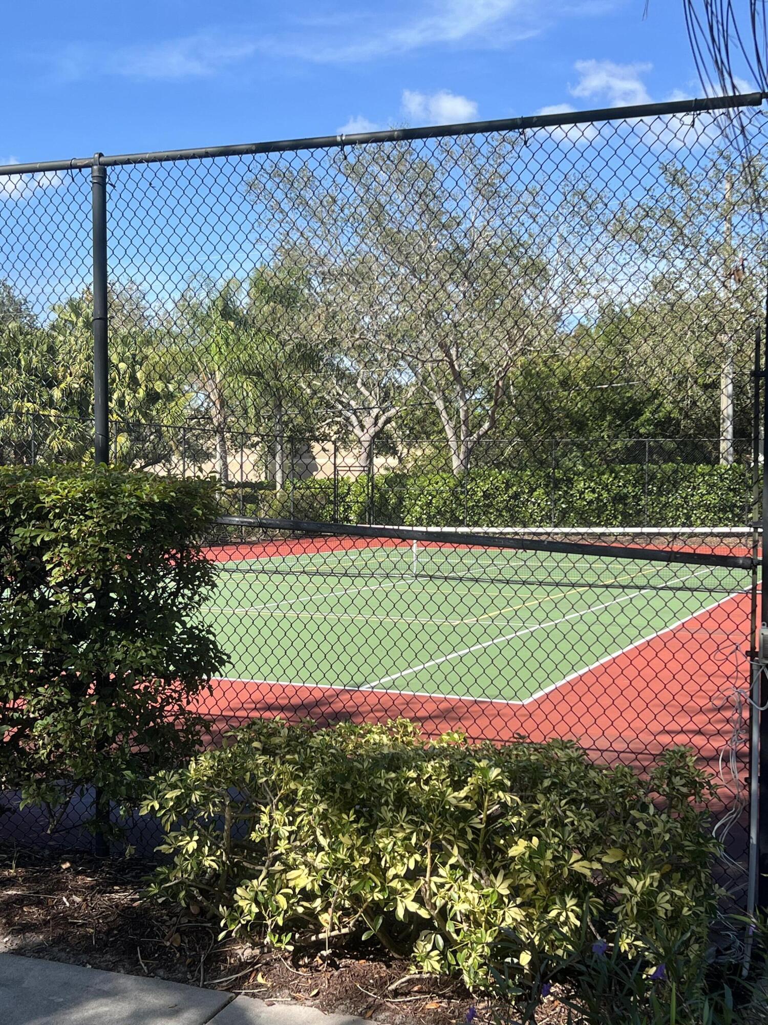 131 Southwest Palm Drive, Unit 203 Port St. Lucie, FL 34986 - Photo 12 of 13 a view of a field with a tree in the background