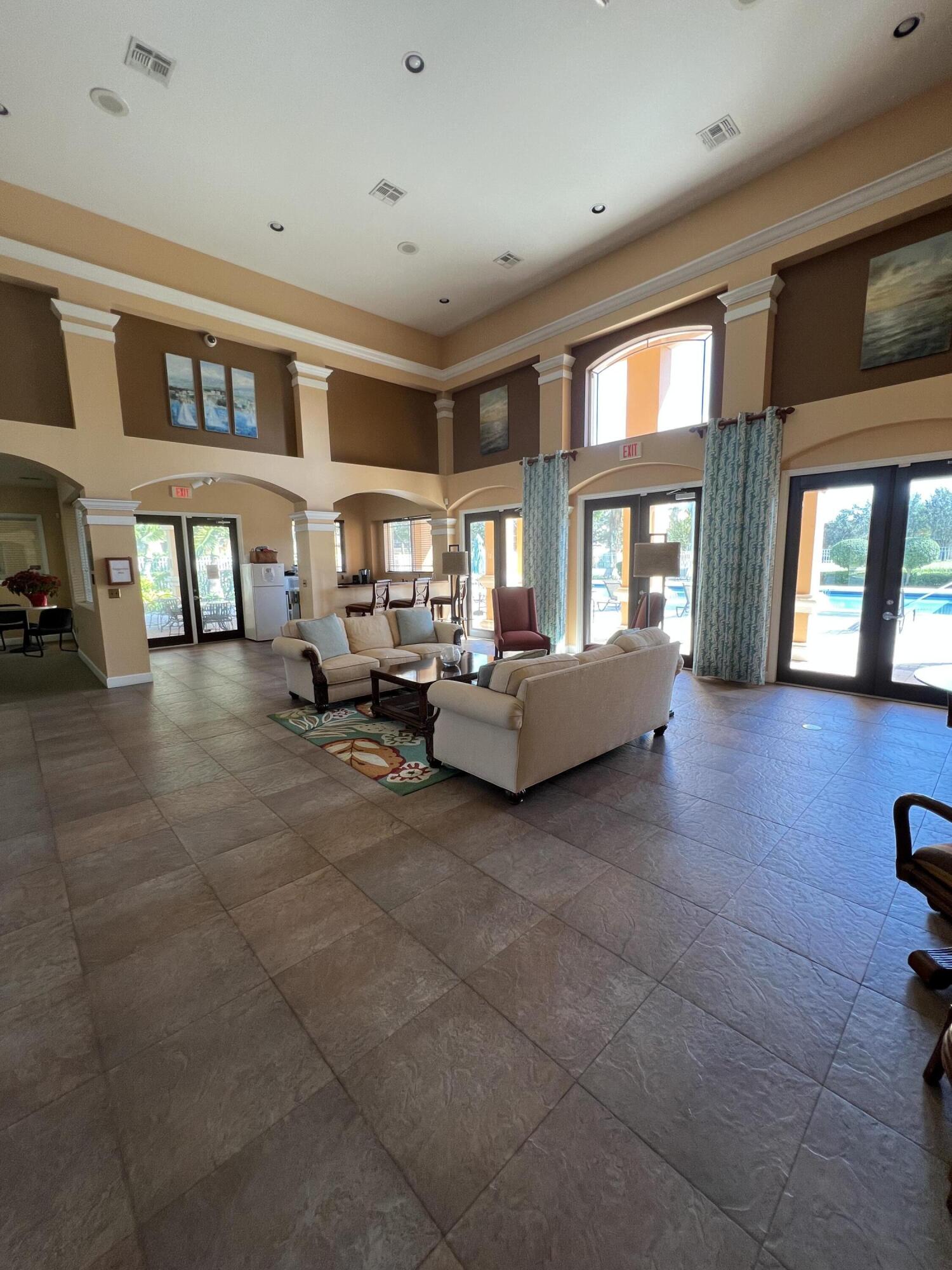 131 Southwest Palm Drive, Unit 203 Port St. Lucie, FL 34986 - Photo 6 of 13 a living room with furniture and a window