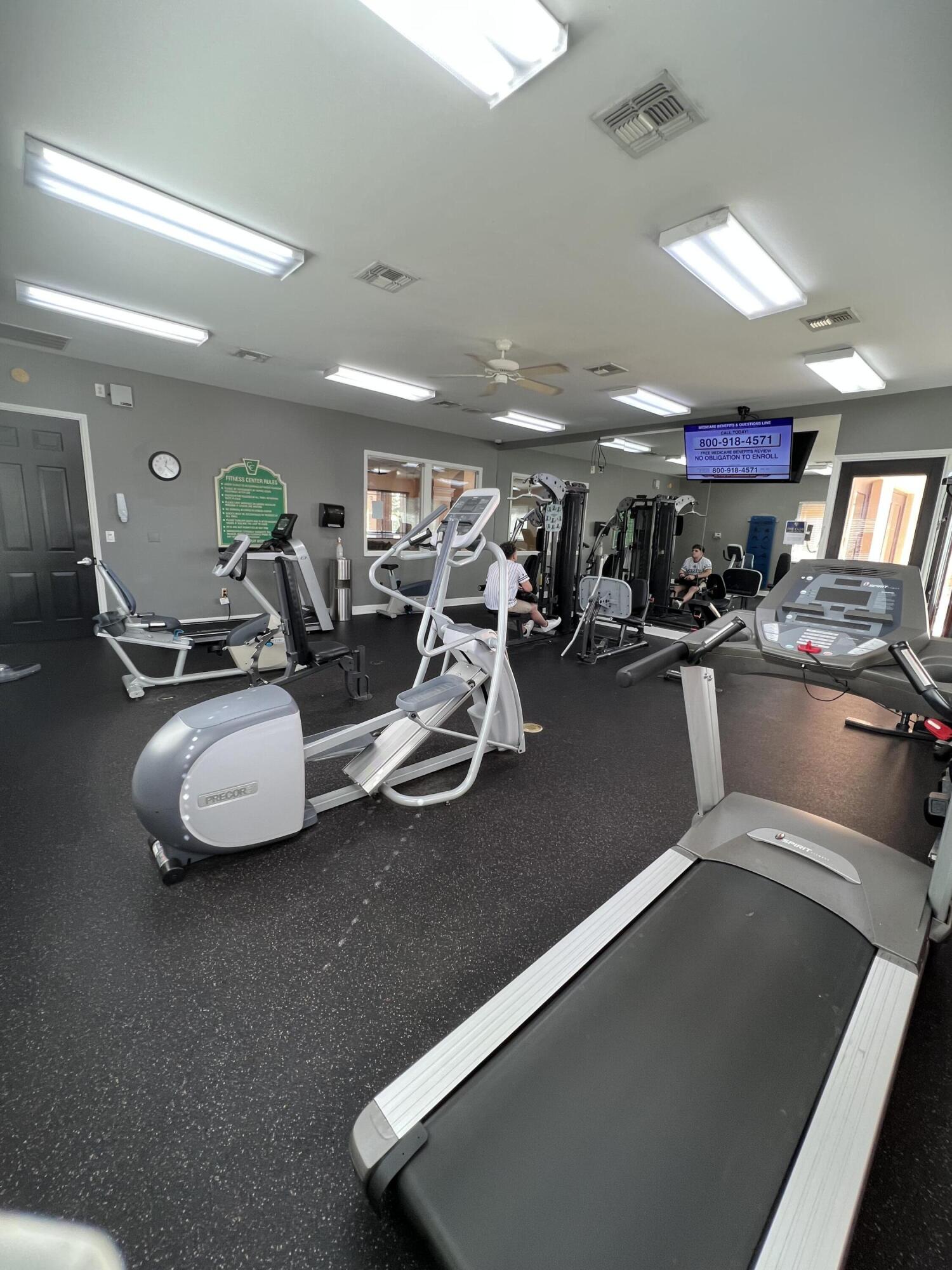 131 Southwest Palm Drive, Unit 203 Port St. Lucie, FL 34986 - Photo 8 of 13 a view of a room with gym equipment