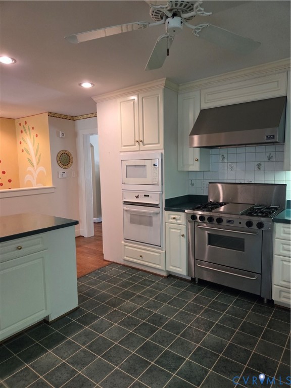 7733 Rock Creek Road Henrico, VA 23229 - Photo 19 of 73 a kitchen with stainless steel appliances a stove and a refrigerator